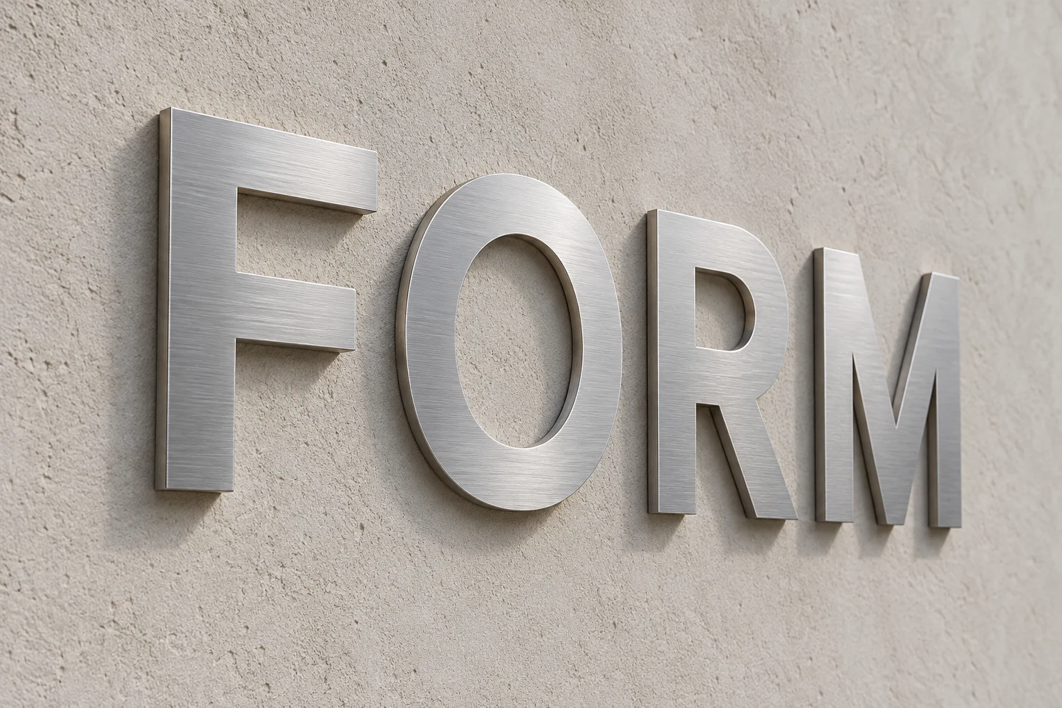 Flat-cut brushed silver FORM metal letters with thin plate edges mounted on a pale wall