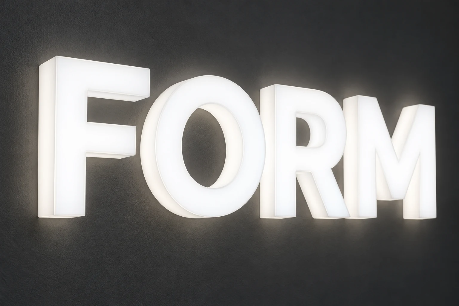 Full-lit acrylic LED letters spelling FORM with illuminated faces and sides